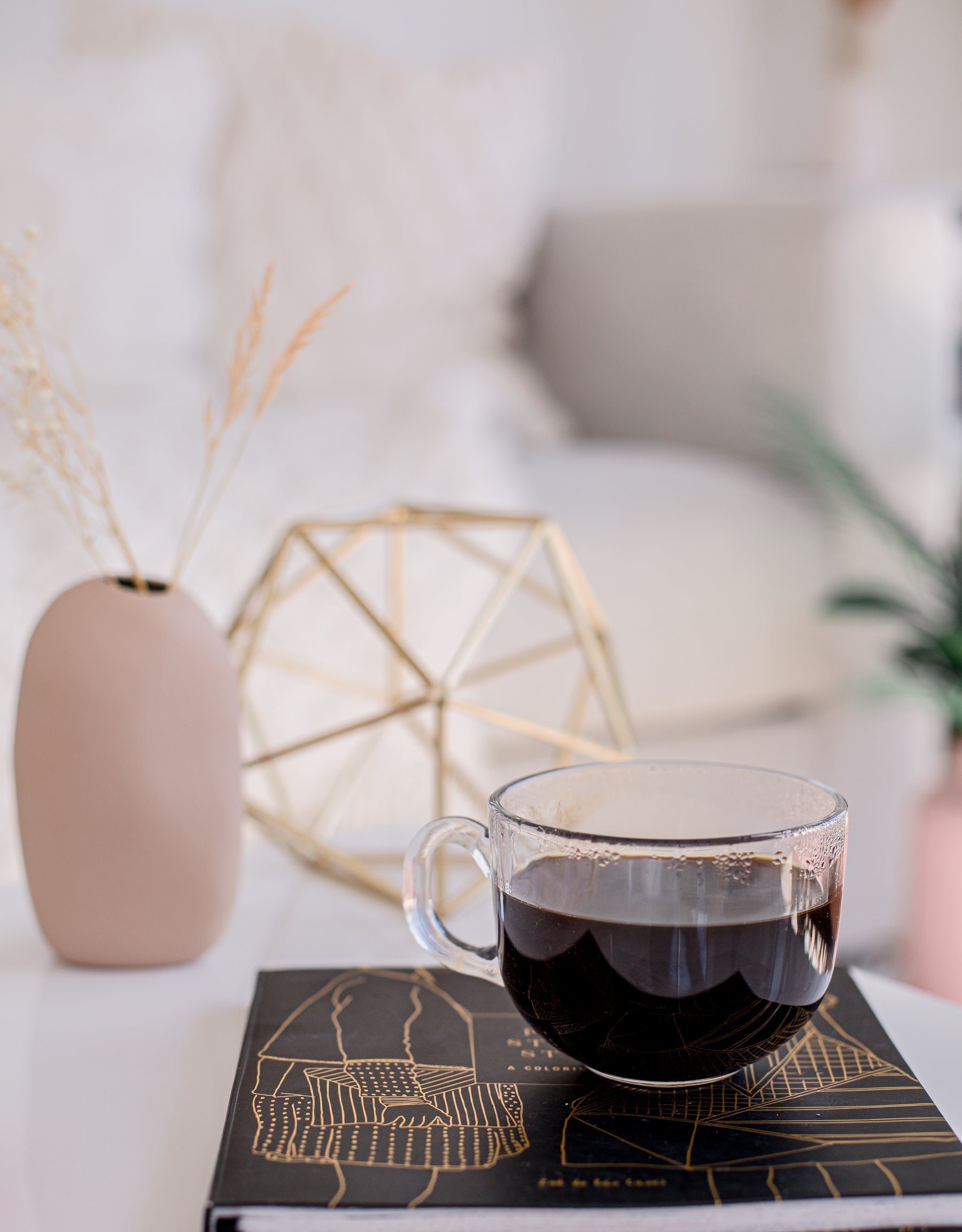 Coffee in a clear cup in a living room